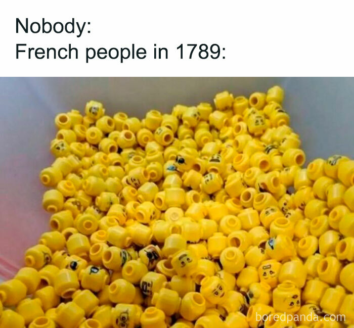 Pile of disassembled Lego heads with "French people in 1789" meme text, referencing history lessons through humor.