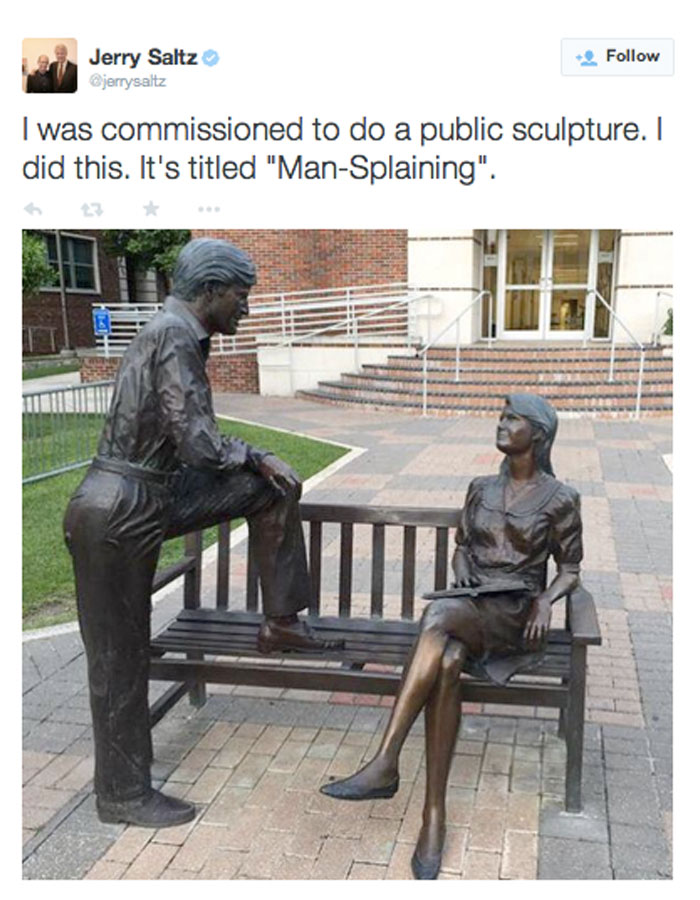 Sculpture titled "Man-Splaining" with a man leaning toward a seated woman, highlighted in a mansplaining meme tweet by Jerry Saltz.
