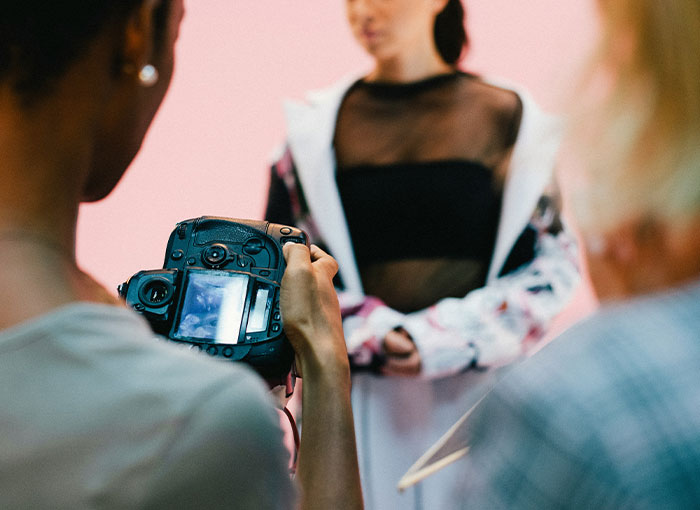 Photographer captures model in Hollywood fashion shoot, focusing on entertainment industry secrets.