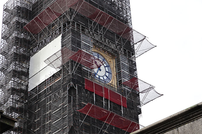 Big Ben under renovation, surrounded by scaffolding, highlighting disappointed travel expectations.