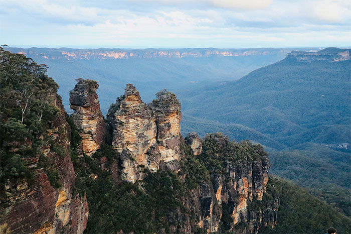 Three Sisters rock formation in Blue Mountains, a travel destination with scenic views but some visitors found it overrated.