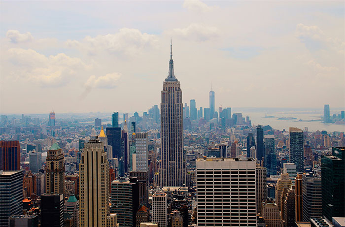 Skyline of New York City with the Empire State Building as a focal point, popular travel destination.