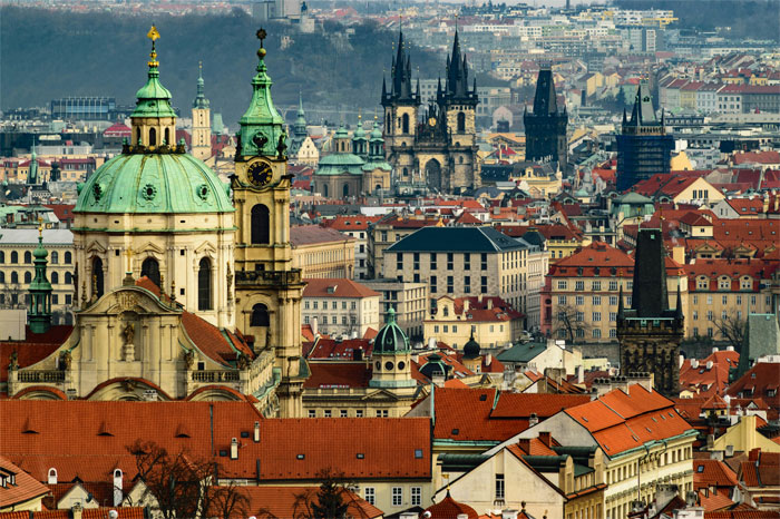 Skyline view of a hyped travel destination with historic buildings and a cathedral.