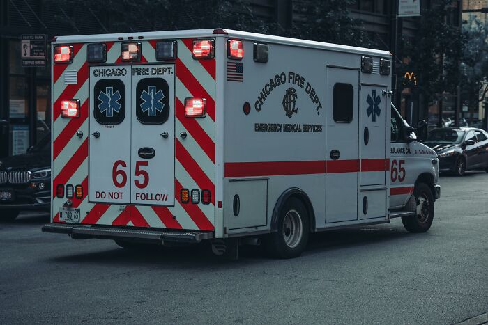 Chicago Fire Department ambulance driving on city street during emergency.
