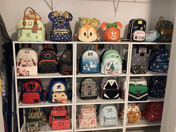 Collection of rare backpacks displayed on shelves in a closet. Collection of rare backpacks displayed on shelves in a closet.