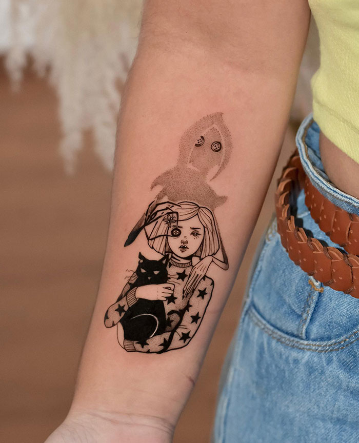 Tattoo of a girl holding a cat on a woman's arm, combining daring and subtle artistry.