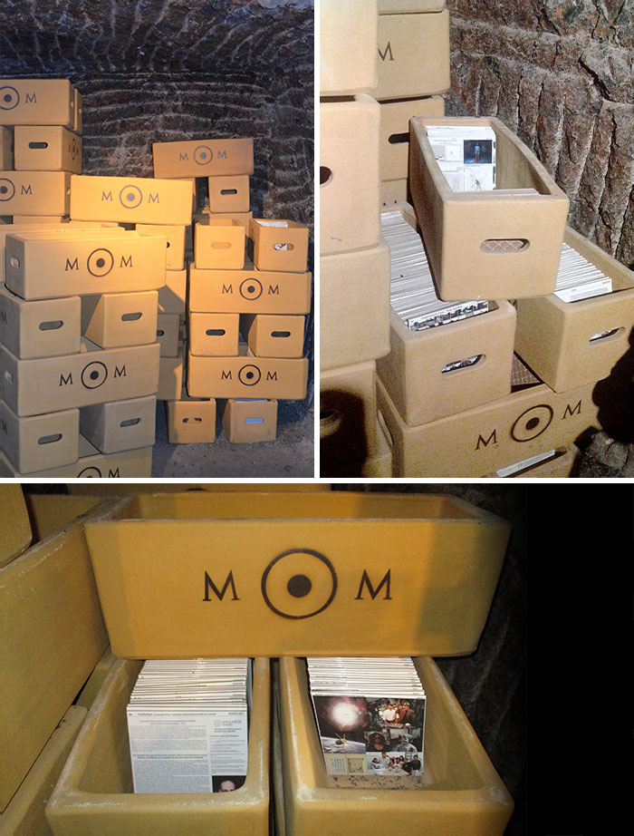 Stacks of labeled boxes filled with magazines revealing historical time capsules.