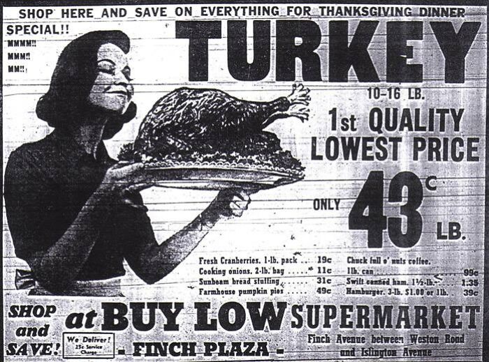 Vintage Thanksgiving ad featuring a woman holding a turkey platter, promoting turkeys for 43 cents per pound at Buy Low Supermarket.