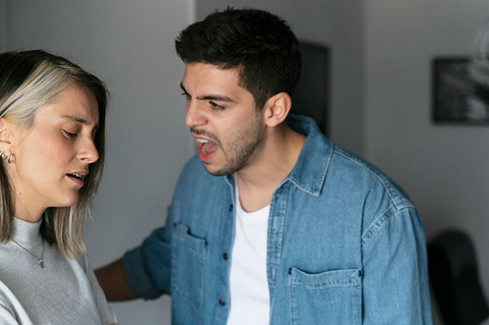 Man upset with woman in tense conversation, highlighting hypocritical husband issue in family dispute. Man upset with woman in tense conversation, highlighting hypocritical husband issue in family dispute.