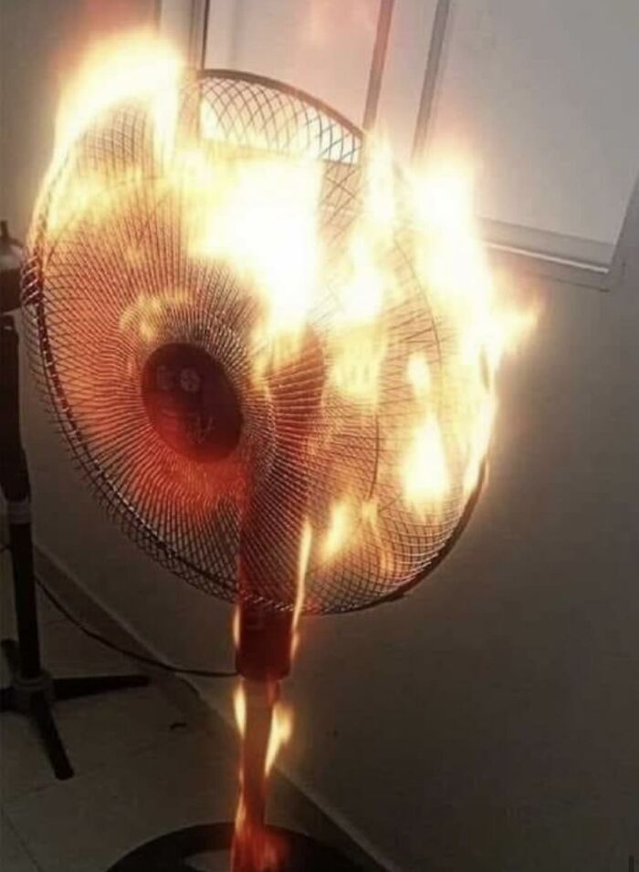 A fan engulfed in flames, resembling a potential creative album cover concept.