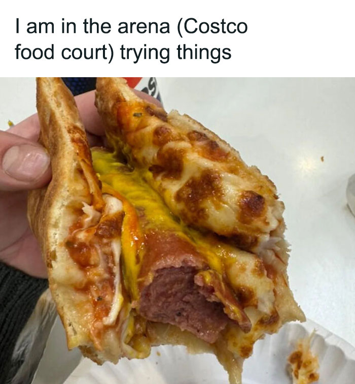 Unusual dish combining pizza and hot dog at a Costco food court with a drink nearby.