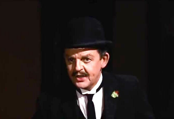 Man in a bowler hat and suit, illustrating a movie joke that took years to understand.