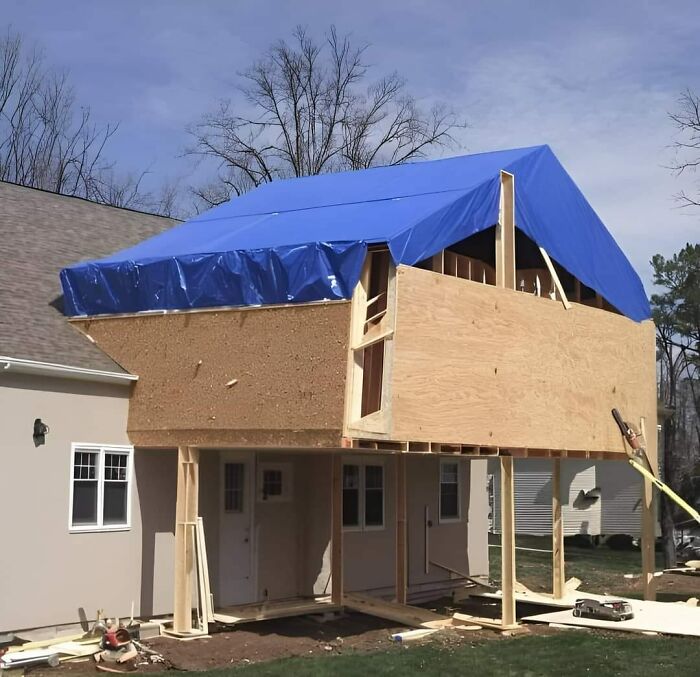 Funny cheap construction fails with an oddly shaped extension and blue tarp roof on a house.