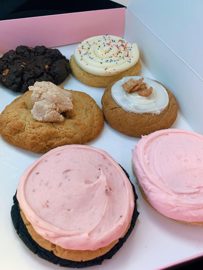 Assorted cookies with colorful frosting, highlighting trends in cookie designs for 2024.