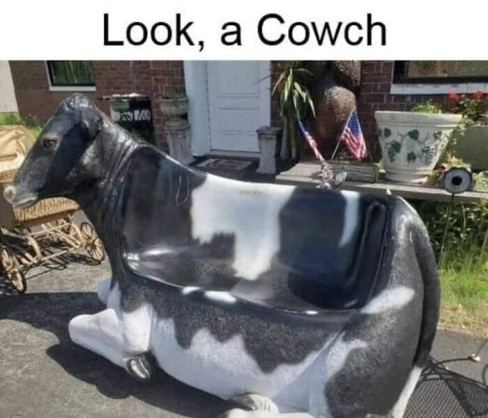Cow-shaped bench with text "Look, a Cowch," illustrating dad humor.