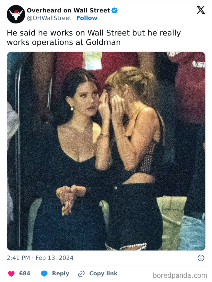 Two women engaging in conversation at an event, reflecting a humorous Wall Street meme.