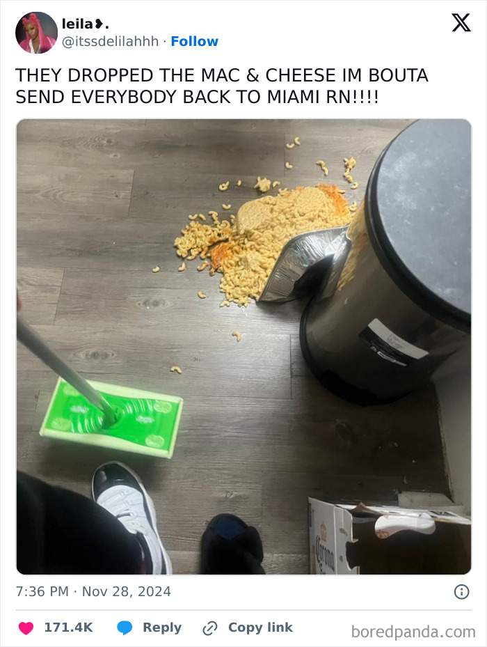 Thanksgiving mishap with spilled mac and cheese on the floor, mop and trash can nearby. Hilarious tweet moment captured.