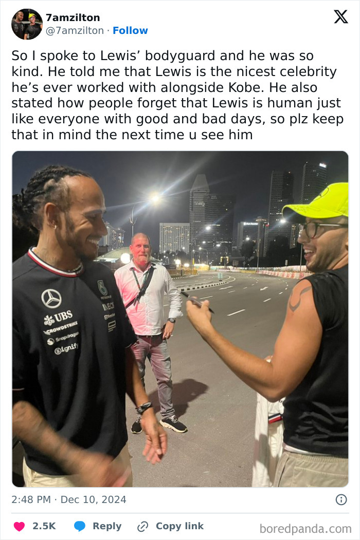 People chatting with a smile on a city street, showcasing a friendly celebrity encounter at night.