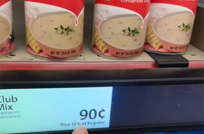 Shelf showing soup cans priced at 90 cents, plus 10% at register, illustrating dystopic retail games. Shelf showing soup cans priced at 90 cents, plus 10% at register, illustrating dystopic retail games.