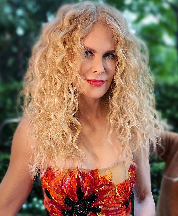Nicole Kidman in a vibrant floral dress.