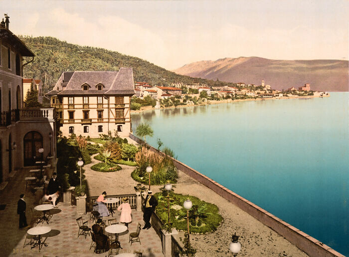 Historic color photo of a lakeside European town with 1920s fashion, showing the world 100 years ago.