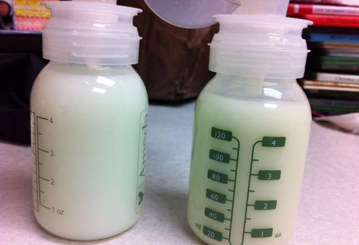 Two bottles of breast milk on a table, highlighting milk replacement issue. Two bottles of breast milk on a table, highlighting milk replacement issue.