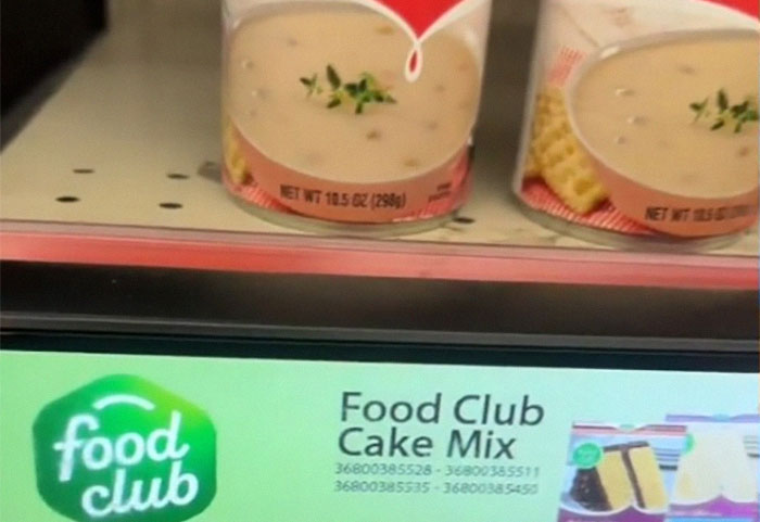 Retail display showing mismatched label of Food Club Cake Mix under soup cans. Retail display showing mismatched label of Food Club Cake Mix under soup cans.