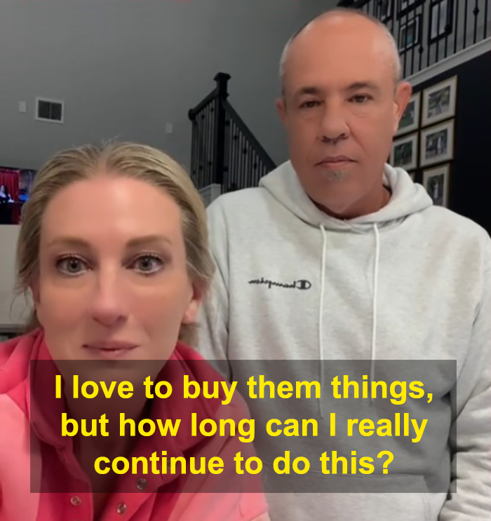 Two parents in a home setting reflecting on buying gifts for their kids, questioning financial sustainability.