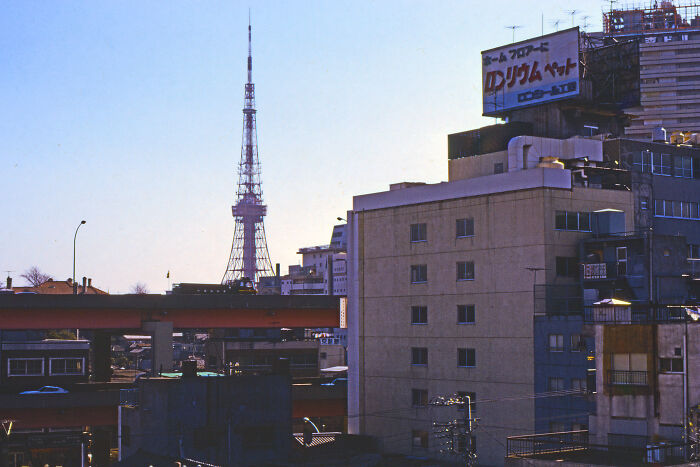Cityscape from 1973 with a prominent tower and urban buildings, capturing a historical view in pictures.