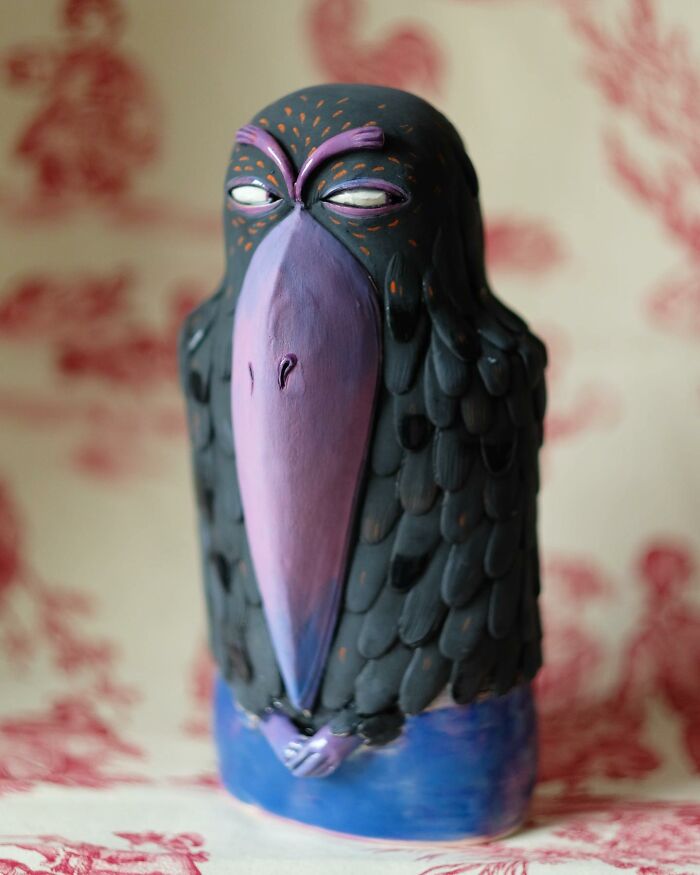 Playful ceramic sculpture of a stylized bird by Nastia Calaca, featuring vibrant colors and intricate patterns.
