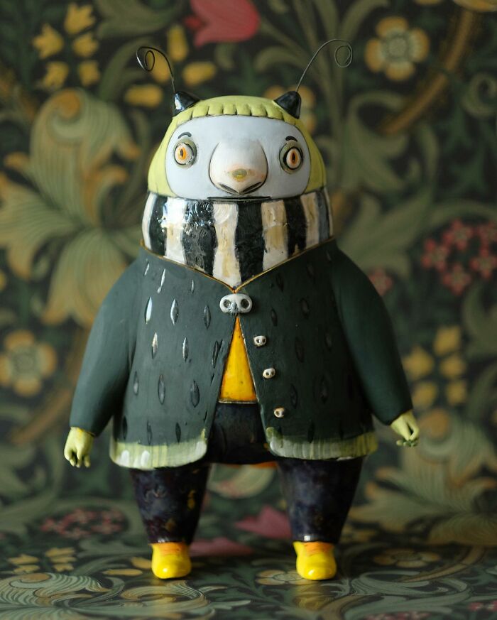 Playful ceramic sculpture by Nastia Calaca, featuring a whimsical creature with colorful detailing and antennae.