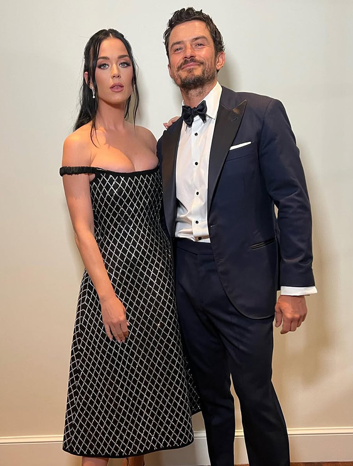 Katy Perry in a black dress with partner Orlando Bloom. Katy Perry in a black dress with partner Orlando Bloom.