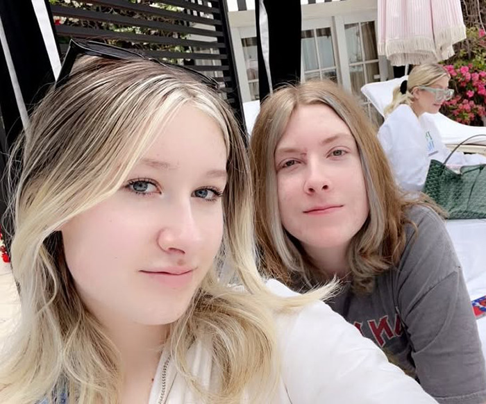 Tori Spelling's children posing for a selfie outdoors.