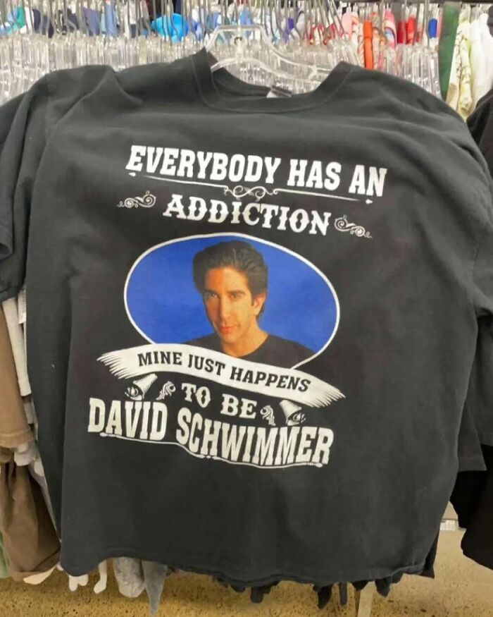 Black shirt with text "Everybody has an a*******n, mine just happens to be David Schwimmer." Features a photo of him.