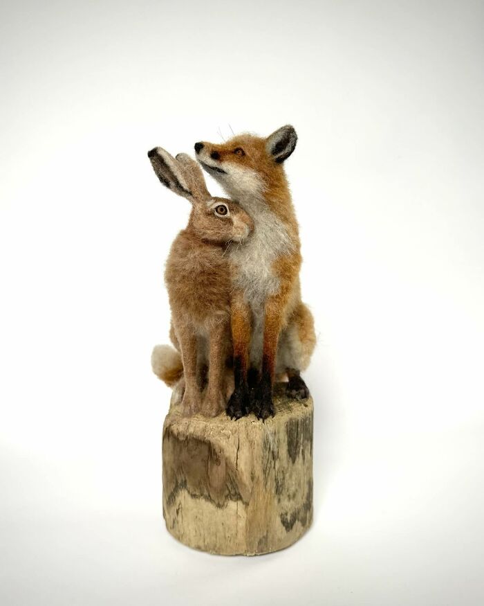 Needle-felted fox and rabbit sculpture by artist, showcasing intricate animal art.