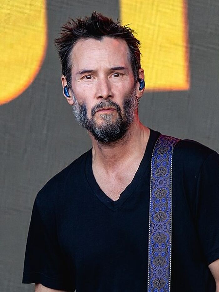 Keanu Reeves standing
