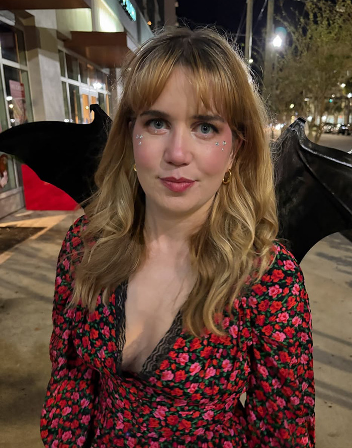 Content creator Maddie Campion in a floral dress with bat wings. Content creator Maddie Campion in a floral dress with bat wings.