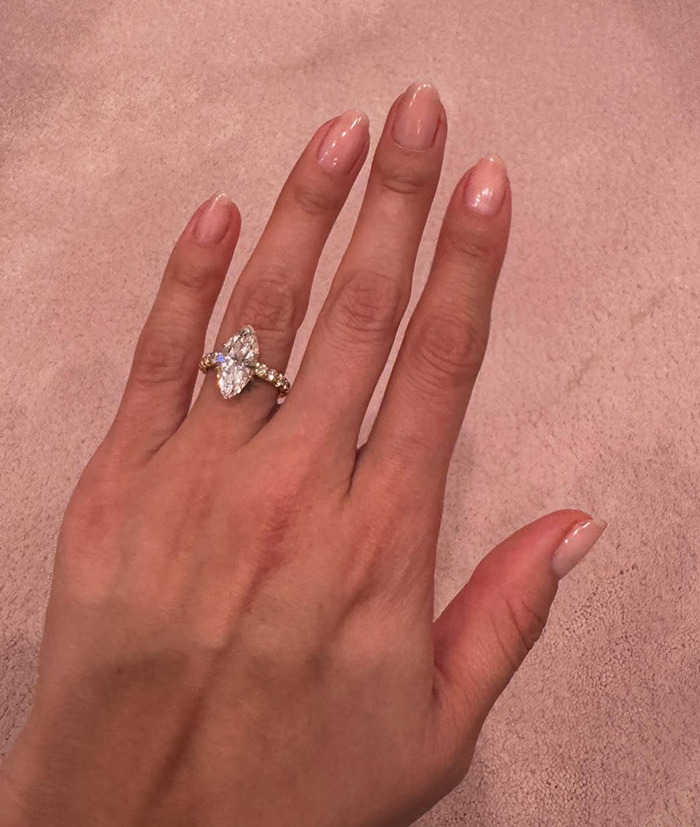 Close-up of Selena Gomez's elegant engagement ring with a large marquise-cut diamond. Close-up of Selena Gomez's elegant engagement ring with a large marquise-cut diamond.
