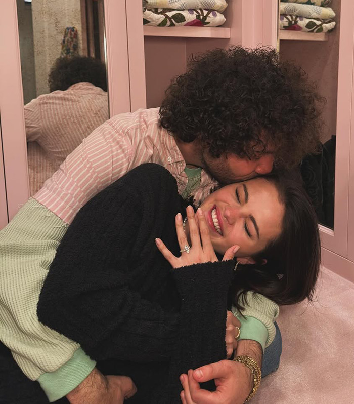 Selena Gomez and Benny Blanco embracing in a cozy setting, highlighting engagement joy.