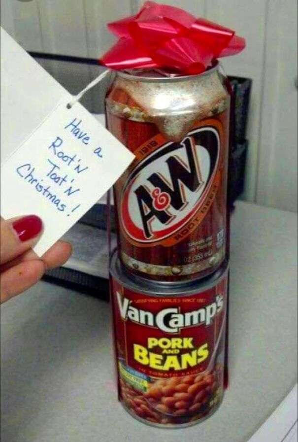 Weird and absurd sign on a gift: A&W root beer can with Van Camp's beans and tag saying "Have a Root'n Toot'n Christmas!"
