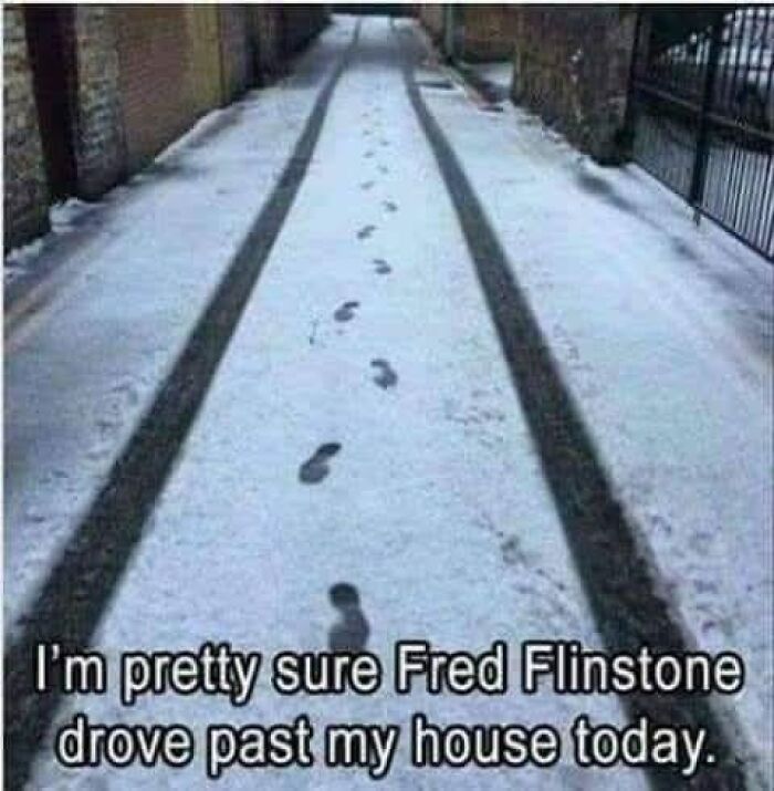 Dad humor post showing footprints and tire tracks in snow with a humorous caption referencing Fred Flintstone.