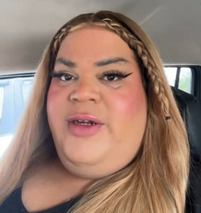 Person sitting in a car with braided hair, highlighting people list trends for 2024.