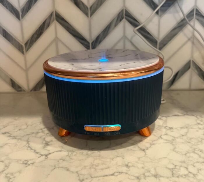 Stylish room diffuser on a marble counter, enhancing Reddit room upgrades.
