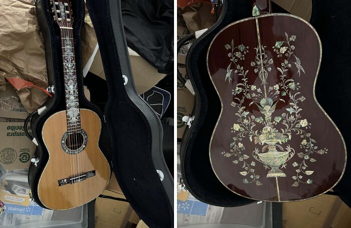 Vintage acoustic guitar with intricate floral inlay design, displayed in an open hard case as a unique inheritance.