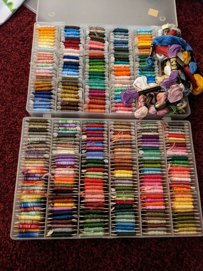 Organized embroidery threads in a box, showcasing vibrant colors favored by amazing mothers-in-law.