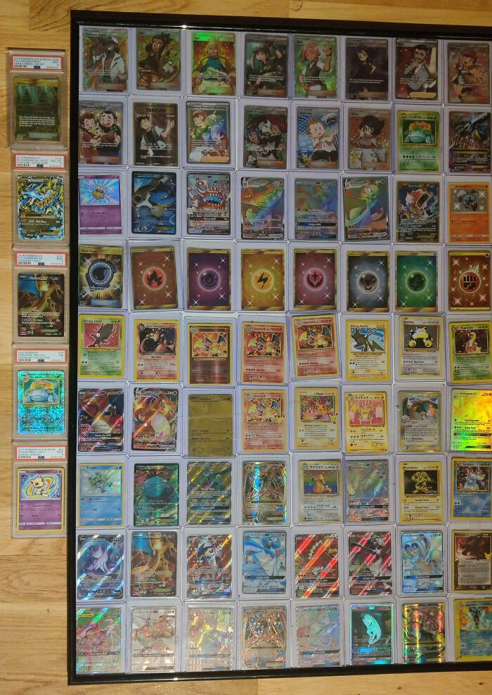 Collection of rare and holographic trading cards displayed in a frame as a cool inheritance collectible.
