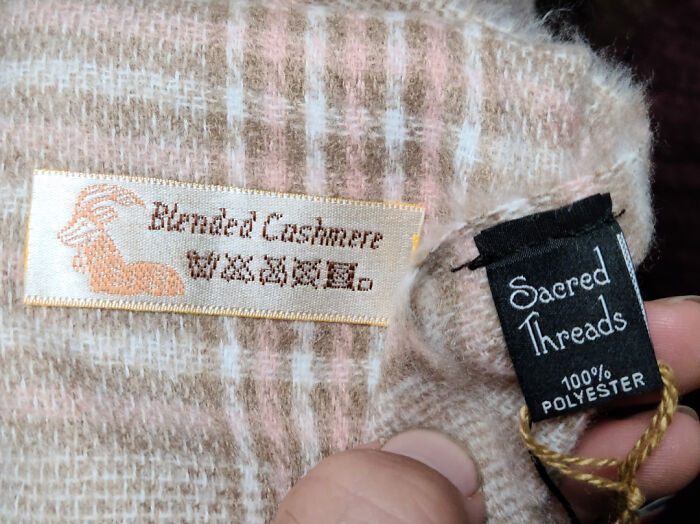 Label showing blended cashmere on fabric misleadingly made of 100% polyester.