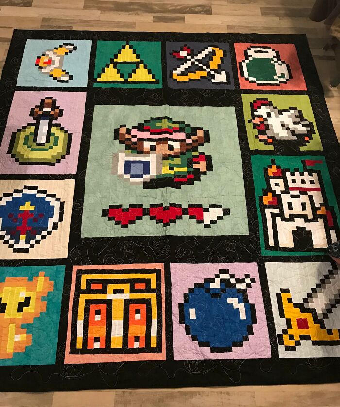 Pixel art quilt featuring iconic video game symbols, an amazing gift idea for mothers-in-law who love gaming.
