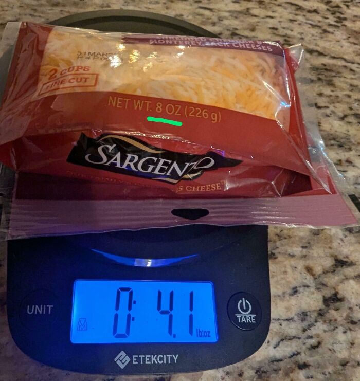 Misleading packaging design example: cheese labeled 8 oz but weighs 4.1 oz on scale.