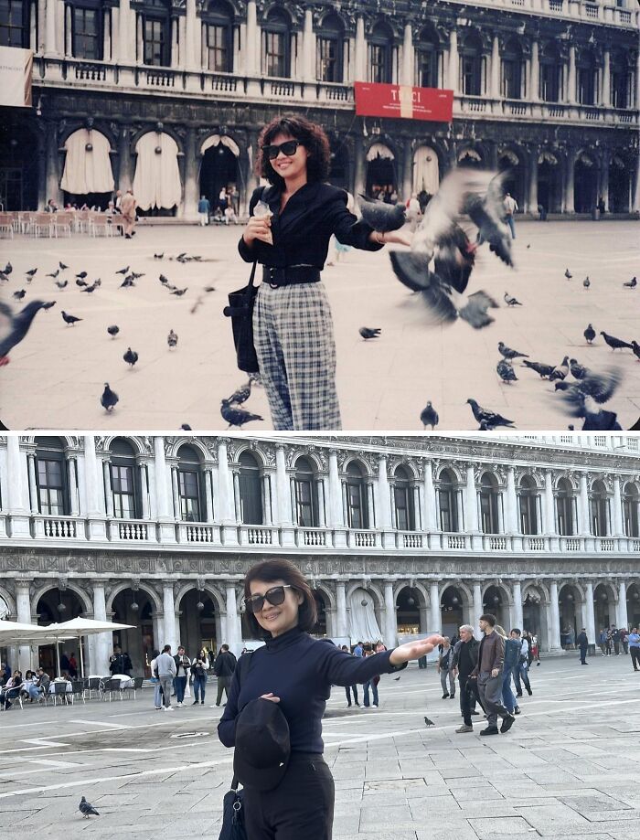 Woman recreating a wholesome family photo in a city square, dressed in sunglasses and black attire, surrounded by pigeons.